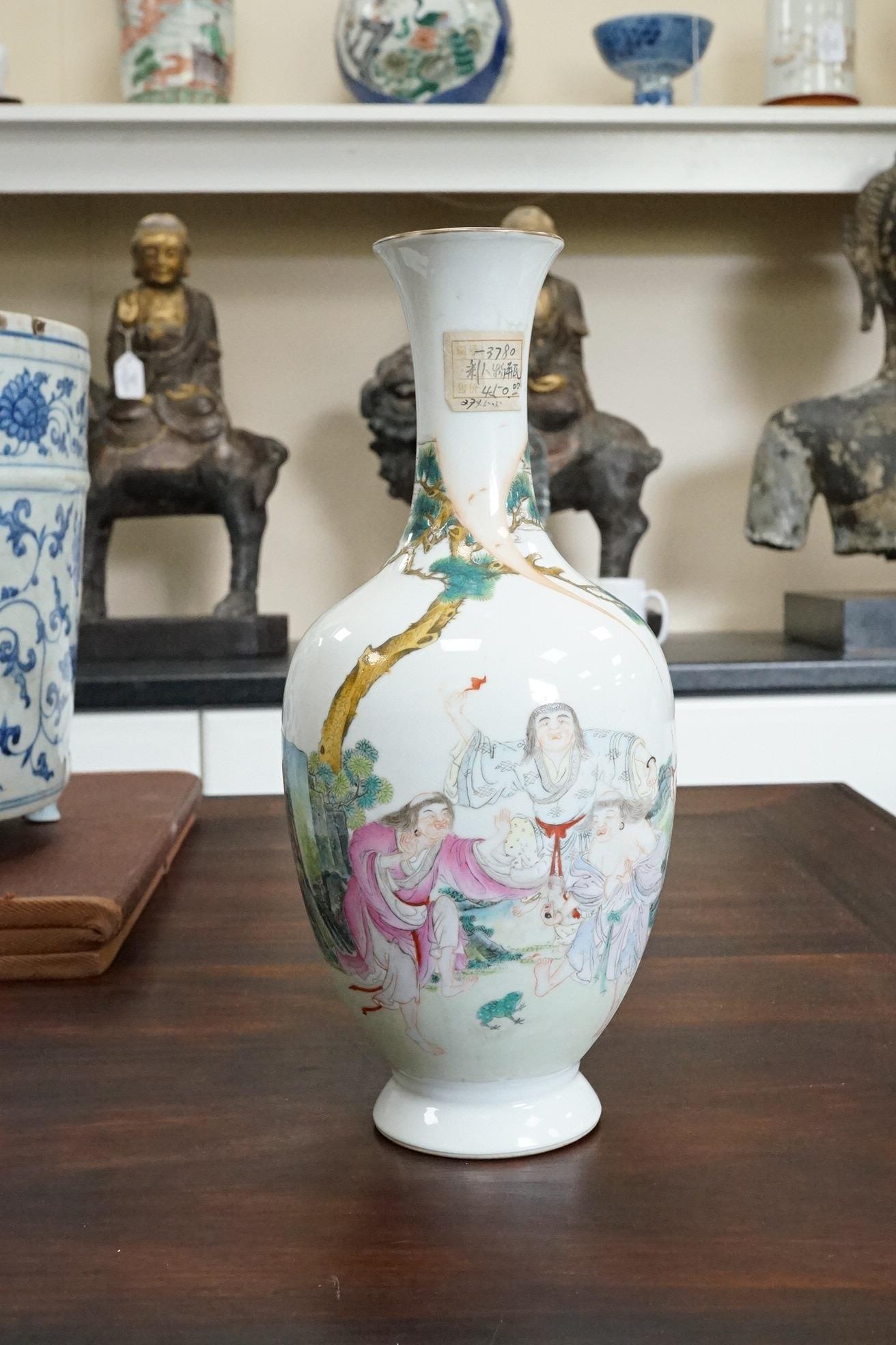 A Chinese famille rose ‘Liu Hai’ bottle vase, Qianlong six character seal mark but Republic period